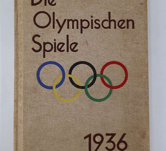 Das Buchcover. Es ist braun mit dem Titel "Die Olympischen Spiele 1936".