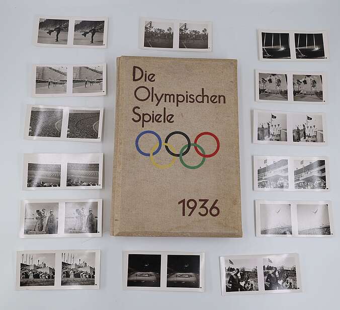 Das Buch "Die Olympischen Spiele 1936" umgeben von Bildern aus dem Buch.